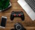 black game console on wooden surface